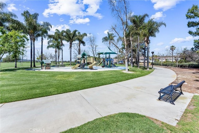 view of community with a playground and a yard