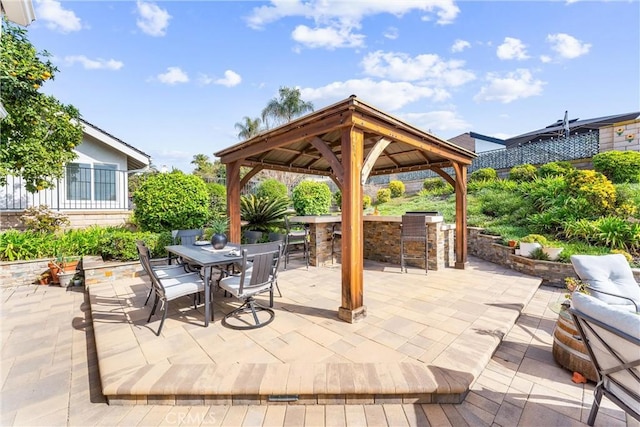 view of patio featuring a gazebo and exterior bar