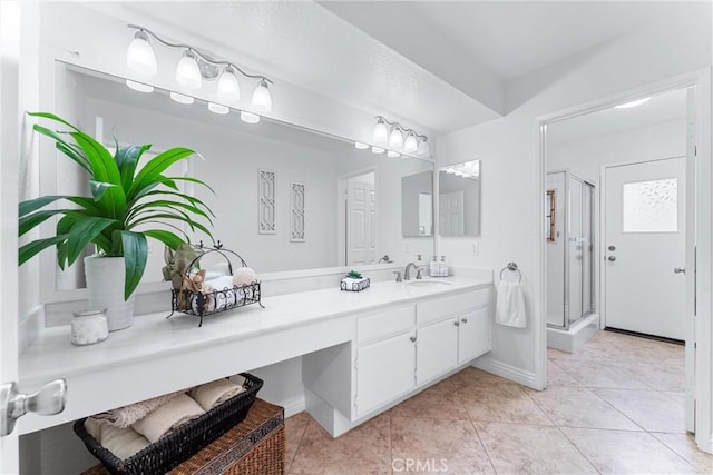 bathroom featuring an enclosed shower, vanity, and tile patterned floors