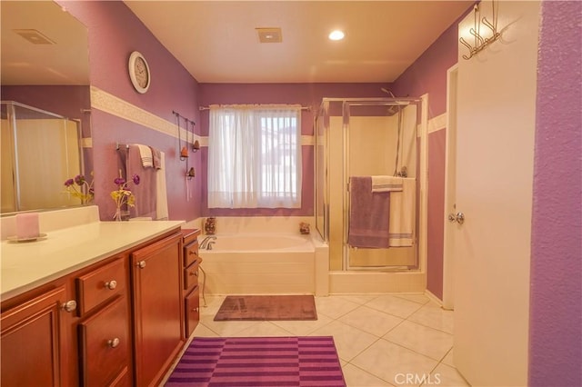 bathroom featuring tile patterned floors, separate shower and tub, and vanity