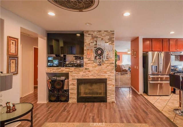 living room with a fireplace and light hardwood / wood-style floors