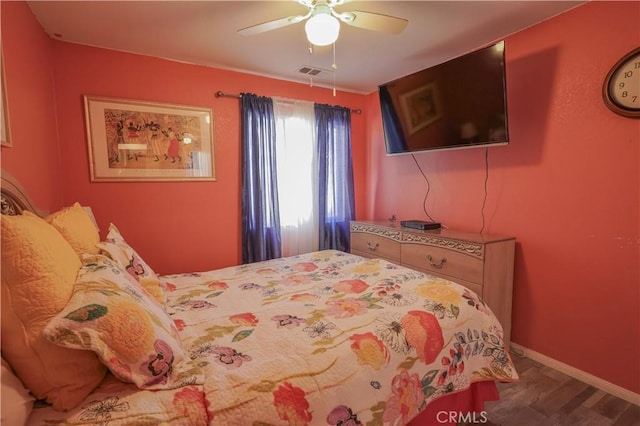 bedroom featuring ceiling fan and hardwood / wood-style floors