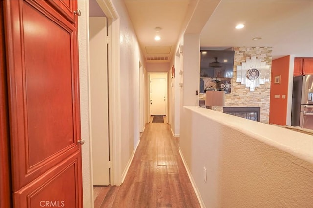 hallway featuring light hardwood / wood-style flooring