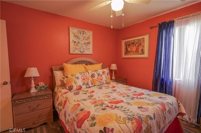 bedroom featuring ceiling fan and wood-type flooring