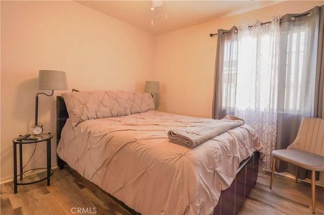 bedroom featuring wood-type flooring