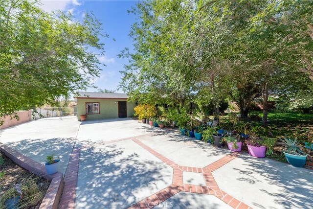 rear view of house featuring a patio