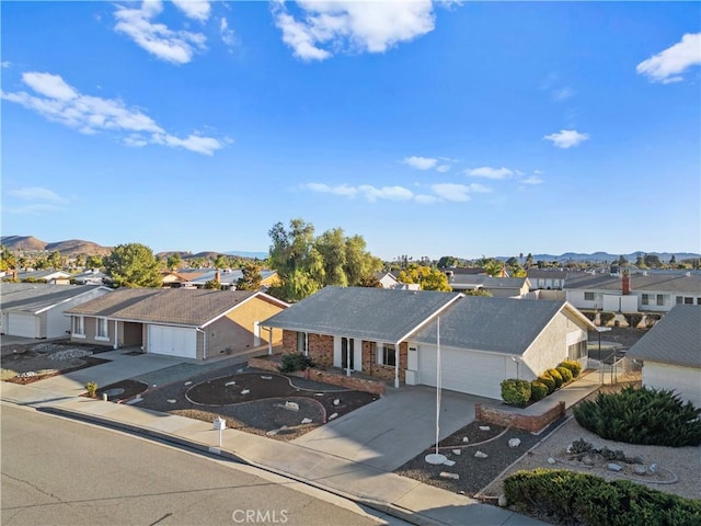 birds eye view of property with a mountain view