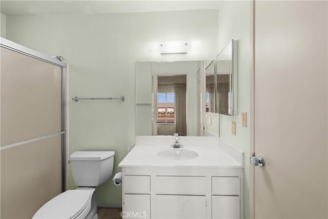 bathroom with toilet and vanity