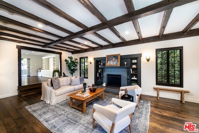 living room featuring a fireplace, beam ceiling, and dark wood-type flooring