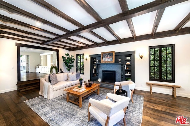 living room featuring dark hardwood / wood-style flooring, a fireplace, and beamed ceiling