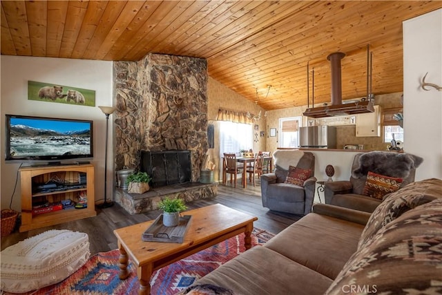 living room featuring vaulted ceiling, wood ceiling, and wood-type flooring