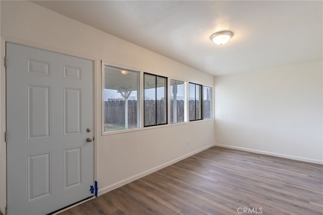 unfurnished room featuring wood-type flooring