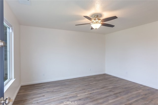 empty room featuring ceiling fan and wood-type flooring