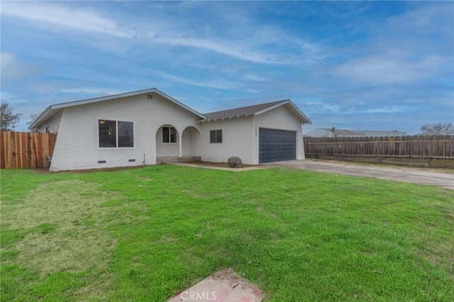 single story home with a front yard and a garage