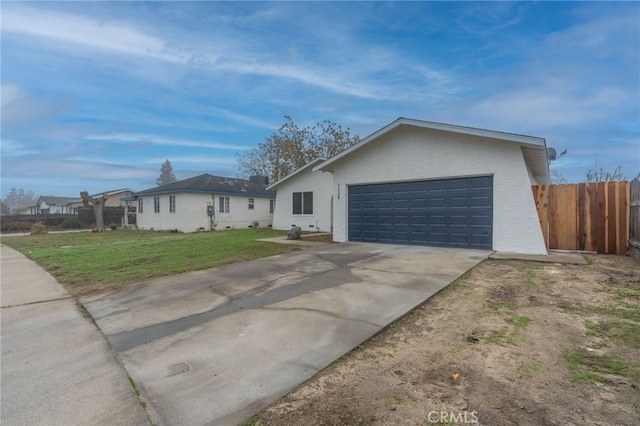 single story home with a front lawn and a garage