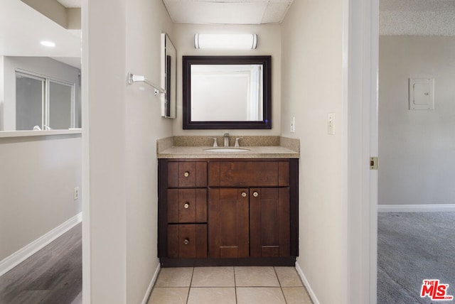 bathroom featuring tile patterned floors and vanity