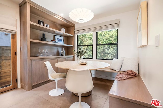 tiled dining area featuring breakfast area