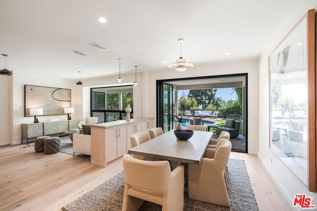 dining area with light wood-type flooring