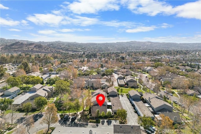 birds eye view of property with a mountain view