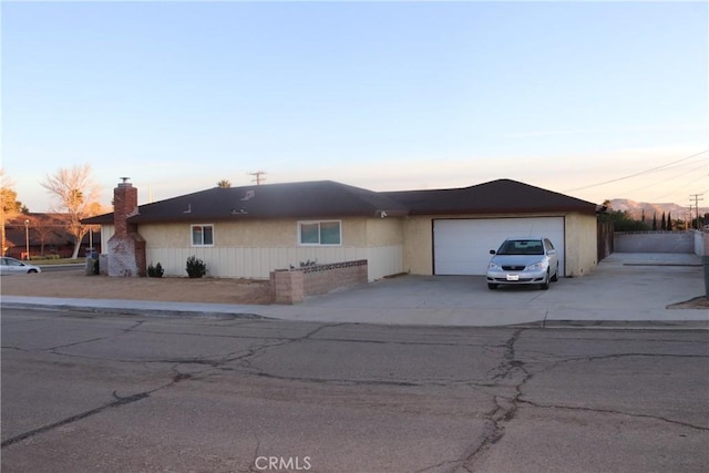 ranch-style house featuring a garage