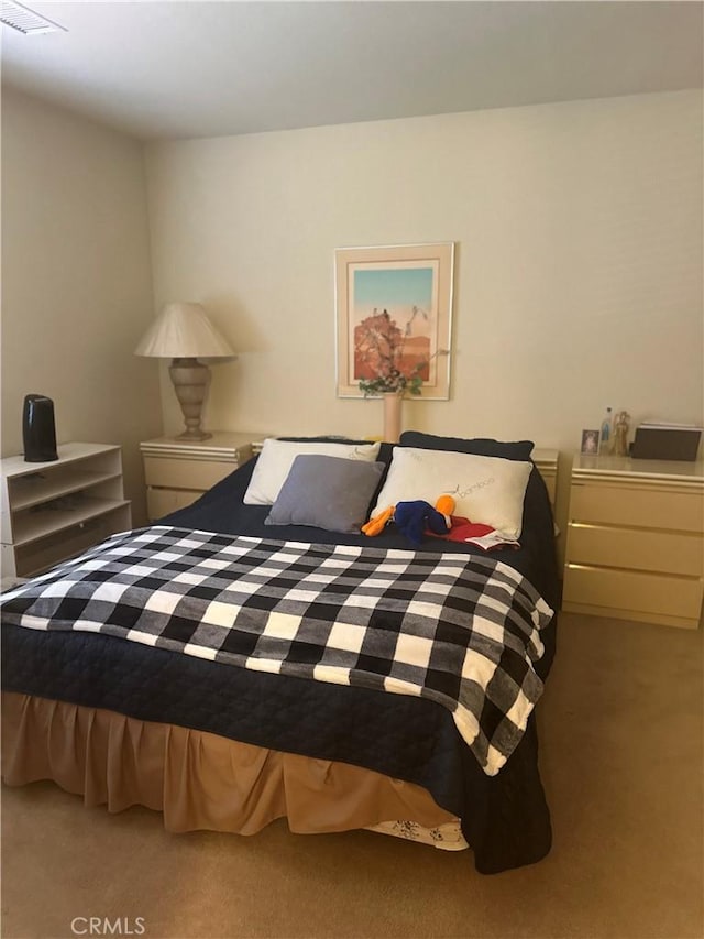 bedroom featuring light carpet