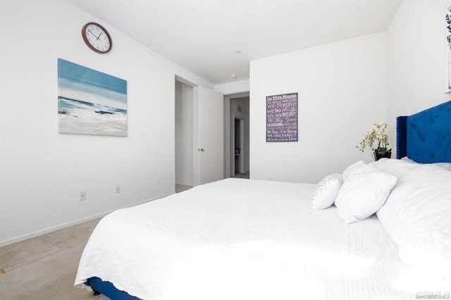 bedroom featuring light carpet