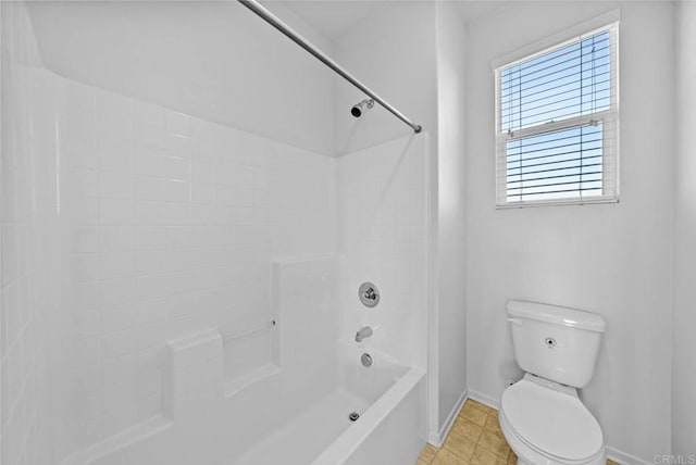 bathroom featuring toilet and  shower combination