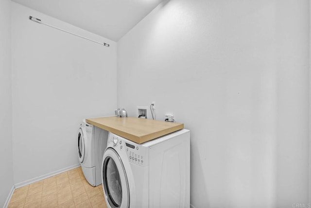 washroom featuring washing machine and clothes dryer