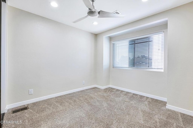 unfurnished room with ceiling fan and carpet flooring