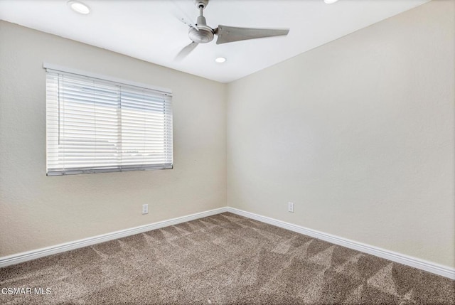 carpeted empty room featuring ceiling fan