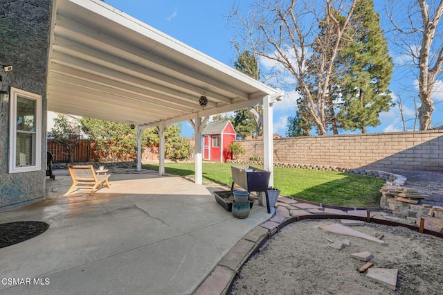 view of patio / terrace featuring a storage unit