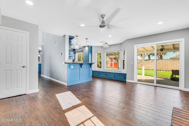 unfurnished living room featuring ceiling fan