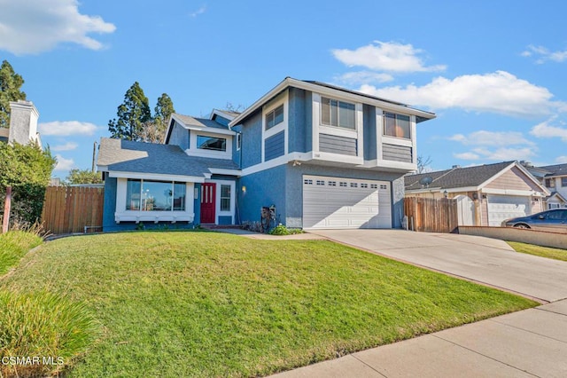 view of front property featuring a garage and a front lawn