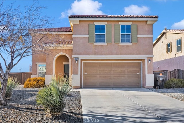 mediterranean / spanish-style house featuring a garage