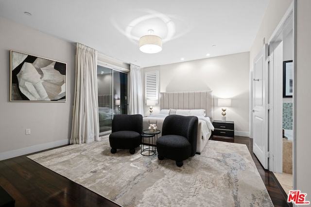 bedroom with hardwood / wood-style floors