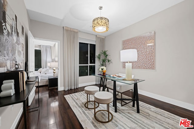 office with dark hardwood / wood-style flooring