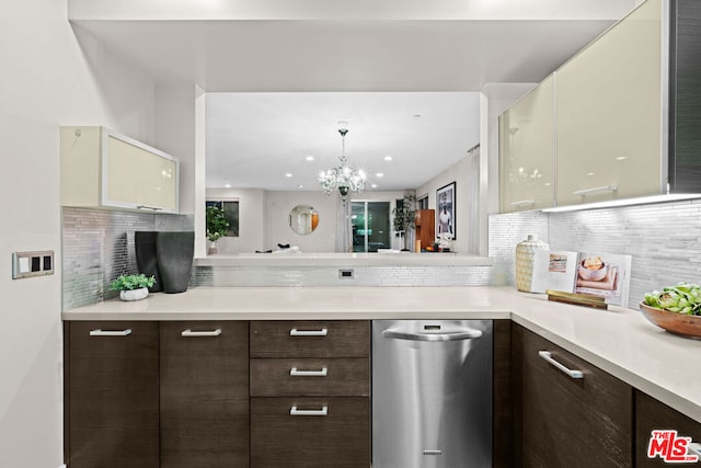 kitchen with tasteful backsplash, an inviting chandelier, white cabinetry, and dark brown cabinetry