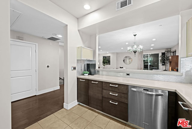 kitchen featuring light tile patterned floors, backsplash, dishwasher, and dark brown cabinets