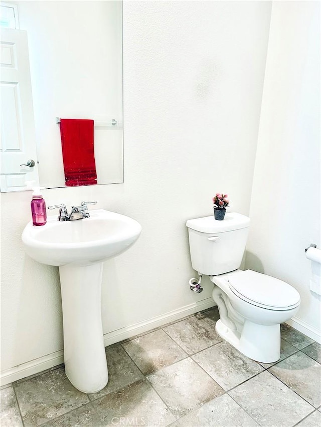 bathroom featuring sink and toilet