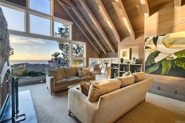 living room with wooden walls, wooden ceiling, light colored carpet, high vaulted ceiling, and beam ceiling