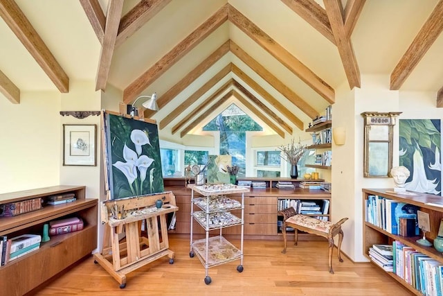 interior space with high vaulted ceiling, beamed ceiling, and hardwood / wood-style floors