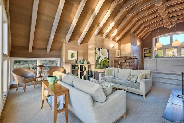 living room featuring beam ceiling, wood walls, and high vaulted ceiling