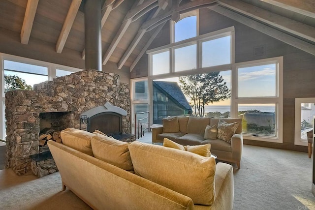 living room featuring carpet, beam ceiling, a fireplace, and high vaulted ceiling