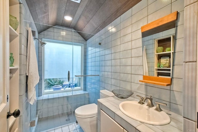 bathroom with lofted ceiling, toilet, tile walls, walk in shower, and tile patterned floors