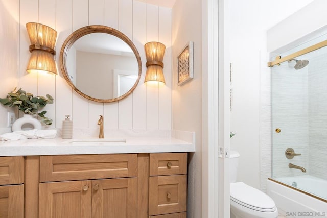 full bathroom featuring enclosed tub / shower combo, toilet, and vanity