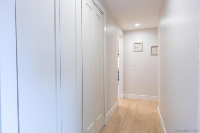 hallway with light wood-type flooring