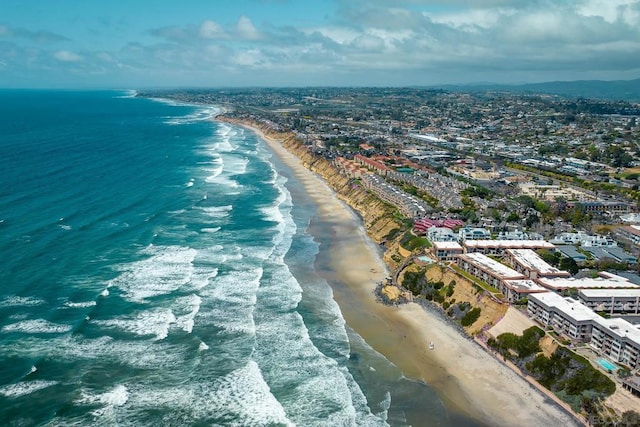 bird's eye view featuring a beach view and a water view