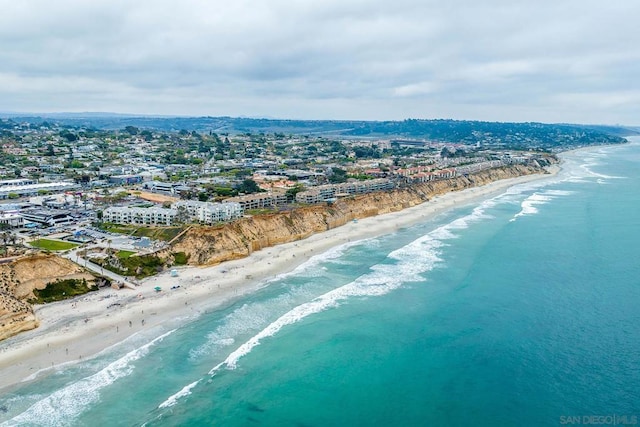 aerial view with a view of the beach and a water view