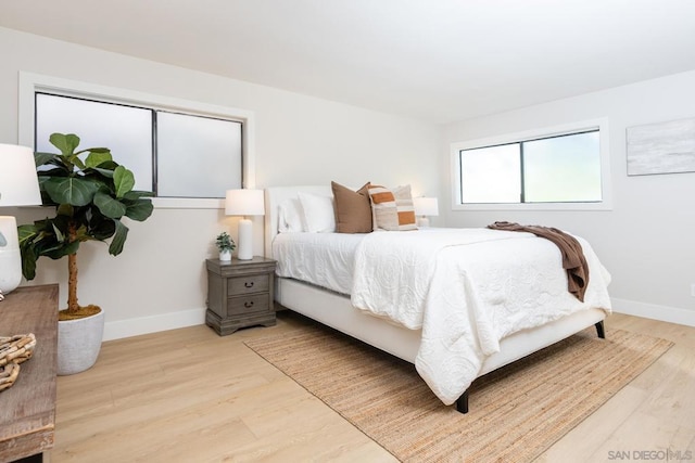 bedroom with light hardwood / wood-style floors