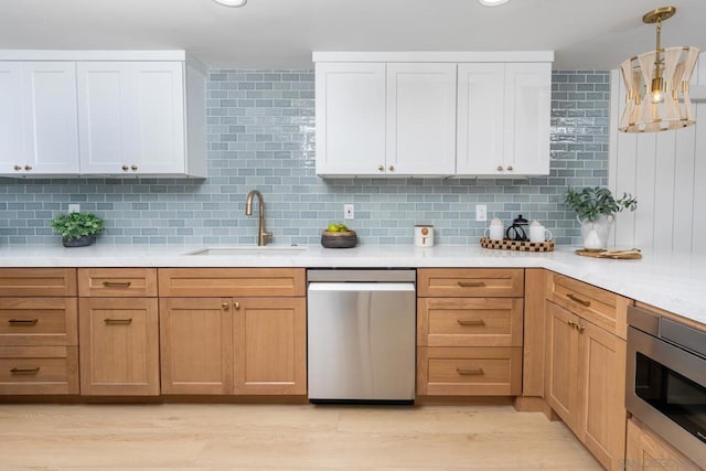 kitchen featuring white cabinets, built in microwave, and tasteful backsplash